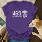 Purple v-neck t-shirt with white text "I KNOW PEOPLE well, I know their dogs" and a dog illustration.
