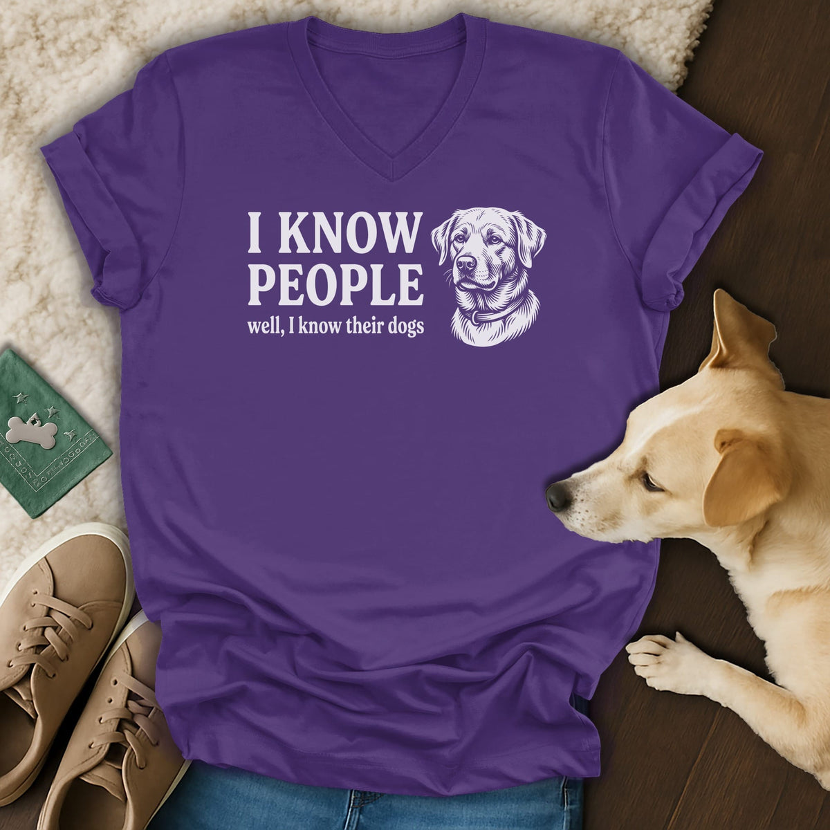 Purple v-neck t-shirt with white text "I KNOW PEOPLE well, I know their dogs" and a dog illustration.