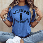 Blue t-shirt with black dog silhouette and text "Be the person your dog thinks you are."