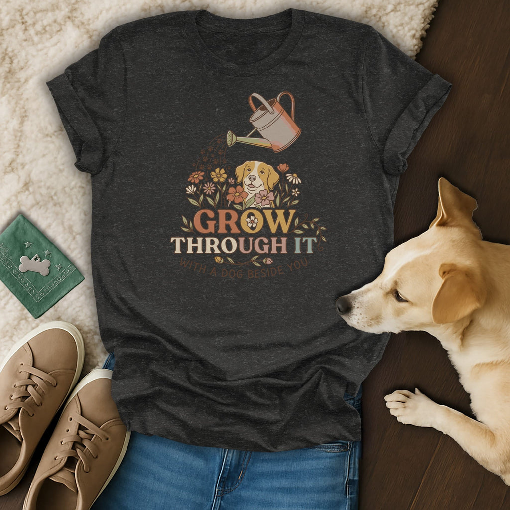 Dark t-shirt with dog and flower graphic saying "Grow Through It With A Dog Beside You."