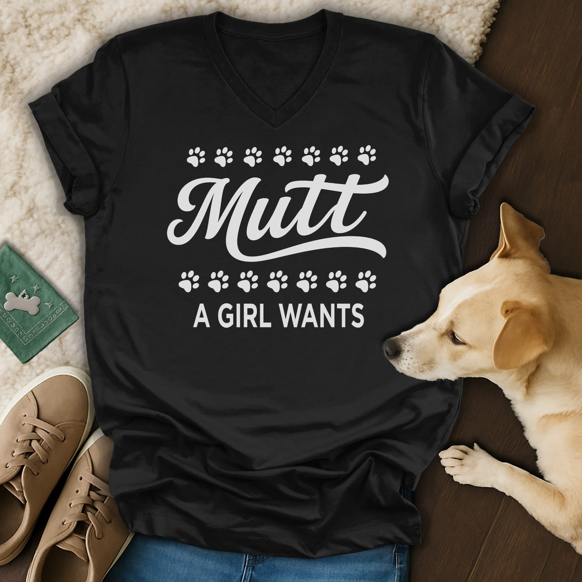 Black v-neck t-shirt with "Mutt A Girl Wants" text and paw prints.
