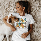 Woman with corgi dog wearing a white t-shirt with corgi graphic.