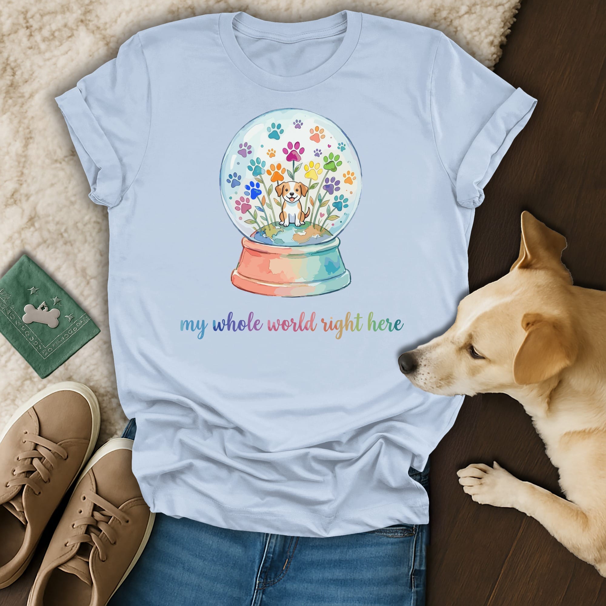 T-shirt with watercolor globe featuring paw prints and flowers, "my whole world right here".