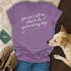 Purple t-shirt with white text "you can't tell me what to do you're not my dog."