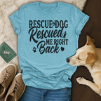 Light blue t-shirt with "Rescue Dog Rescued Me Right Back" text, next to a dog.