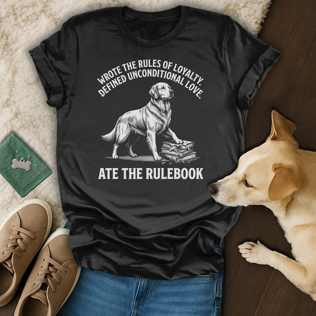 Black t-shirt with a dog standing on books, text reads: "Wrote the rules of loyalty. Defined unconditional love. Ate the rulebook."