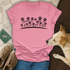 Pink t-shirt with black floral paw print and bone design.