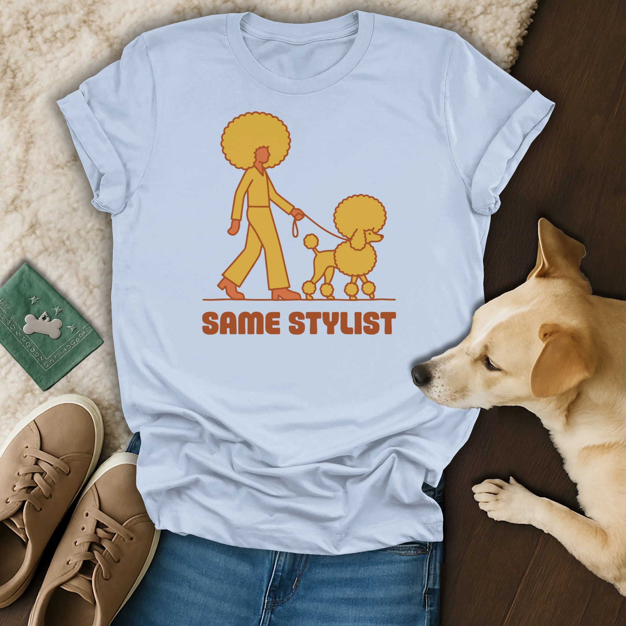 T-shirt with illustration of person walking poodle, text "SAME STYLIST".