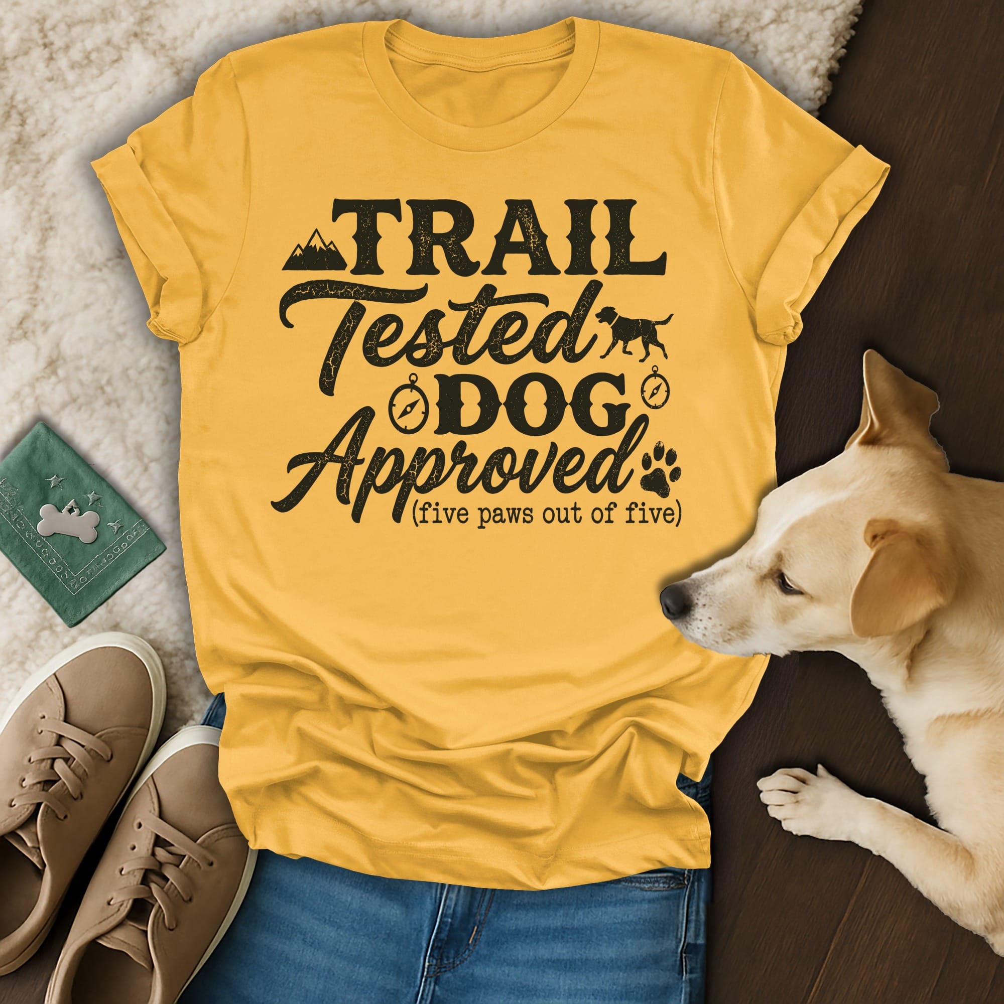 Yellow t-shirt with "Trail Tested Dog Approved (five paws out of five)" text and dog graphic.