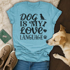 Blue t-shirt with "DOG IS MY LOVE LANGUAGE" text and dog paw print.