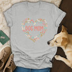 Gray v-neck t-shirt with "DOG MOM" in a heart of dog-themed icons.