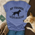 Blue t-shirt with black dog silhouette and text "MY TRAINER ACCEPTS NO EXCUSES."