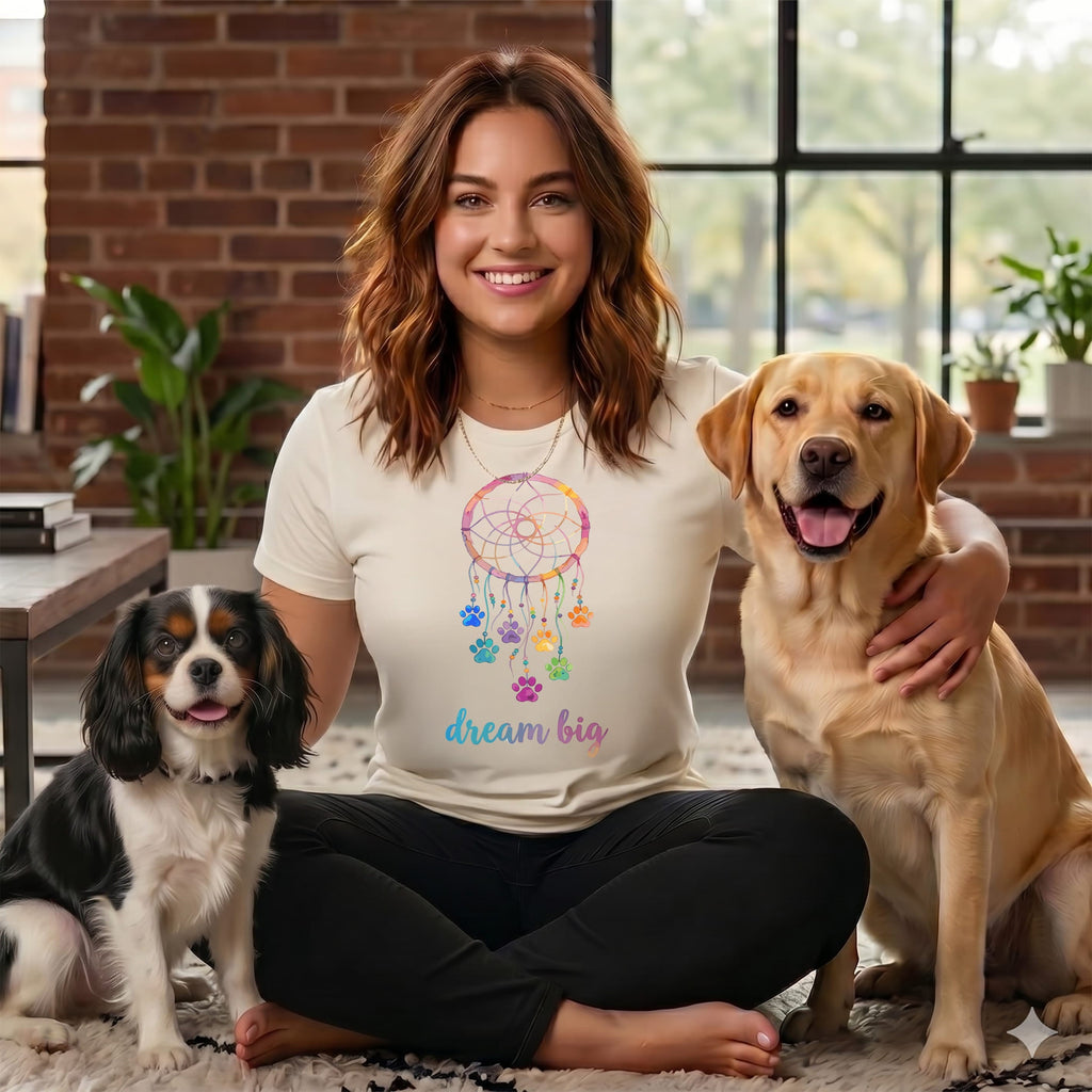 Woman with two dogs, one Cavalier King Charles, one Labrador, and dream catcher design.