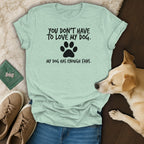 Light green t-shirt with black text reading "You don't have to love my dog. My dog has enough fans."