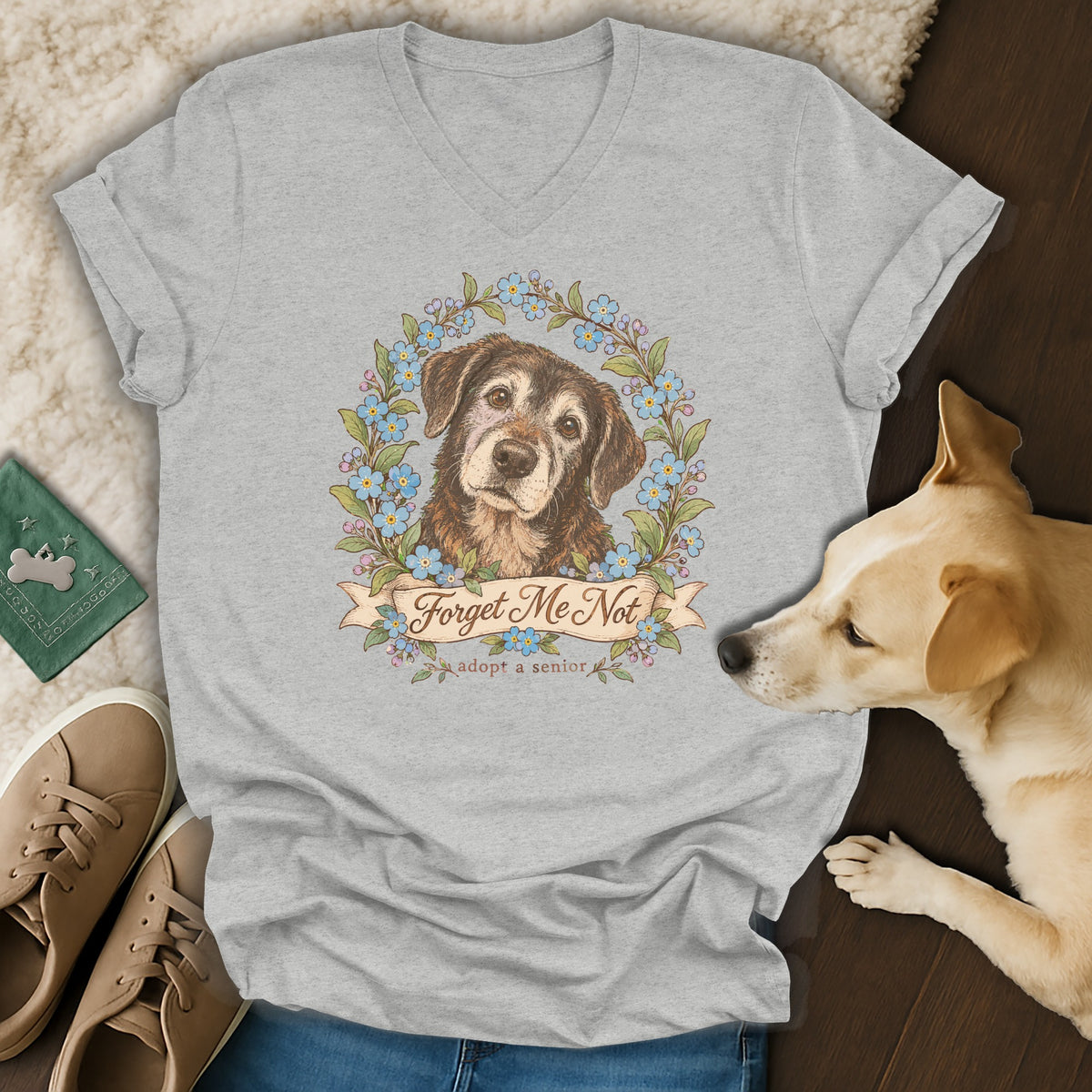 Heather gray V-neck t-shirt featuring a senior dog graphic framed by blue forget-me-not flowers and the text Forget Me Not.