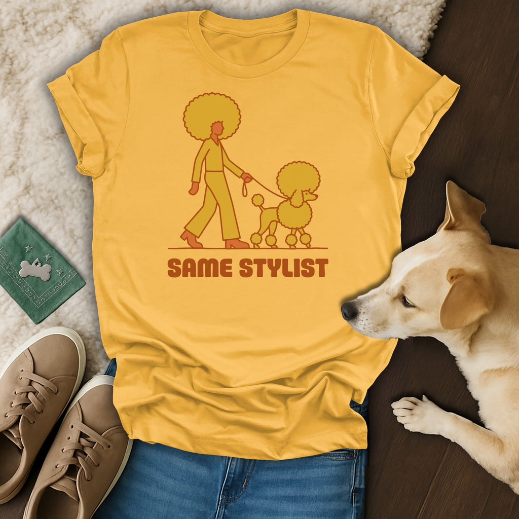 Yellow t-shirt with a graphic of a person walking a poodle, text "SAME STYLIST".
