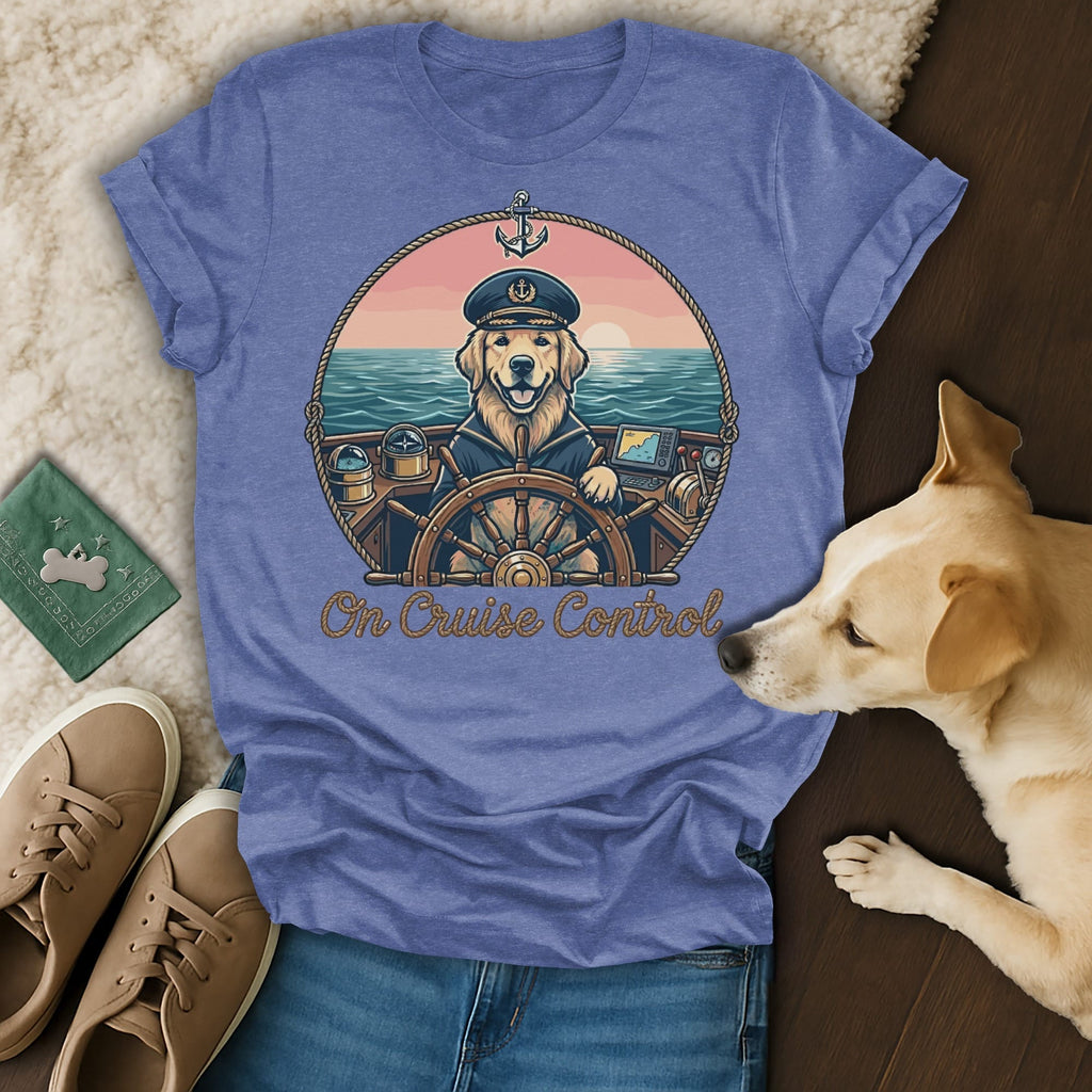 Blue t-shirt with golden retriever captain on a boat at sunset, text "On Cruise Control".