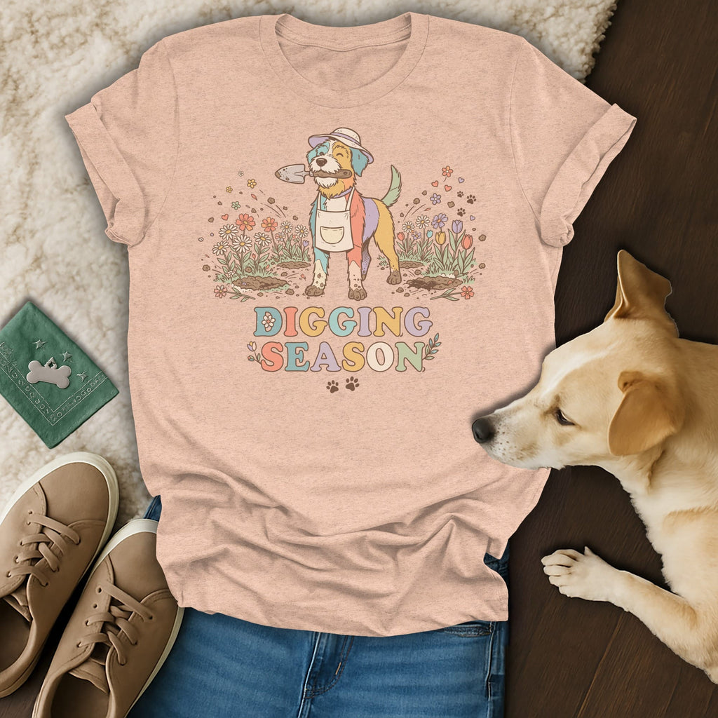 Peach t-shirt with colorful dog in garden, "Digging Season" text.