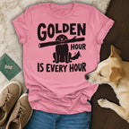Pink t-shirt with black text and dog graphic: "GOLDEN HOUR IS EVERY HOUR".