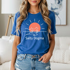 Blue t-shirt with white dog running under a sun, text "Salty Dogma".