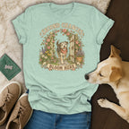 Light green t-shirt with a vintage illustration of a dog, flowers, and the text Second Chances Bloom Here.