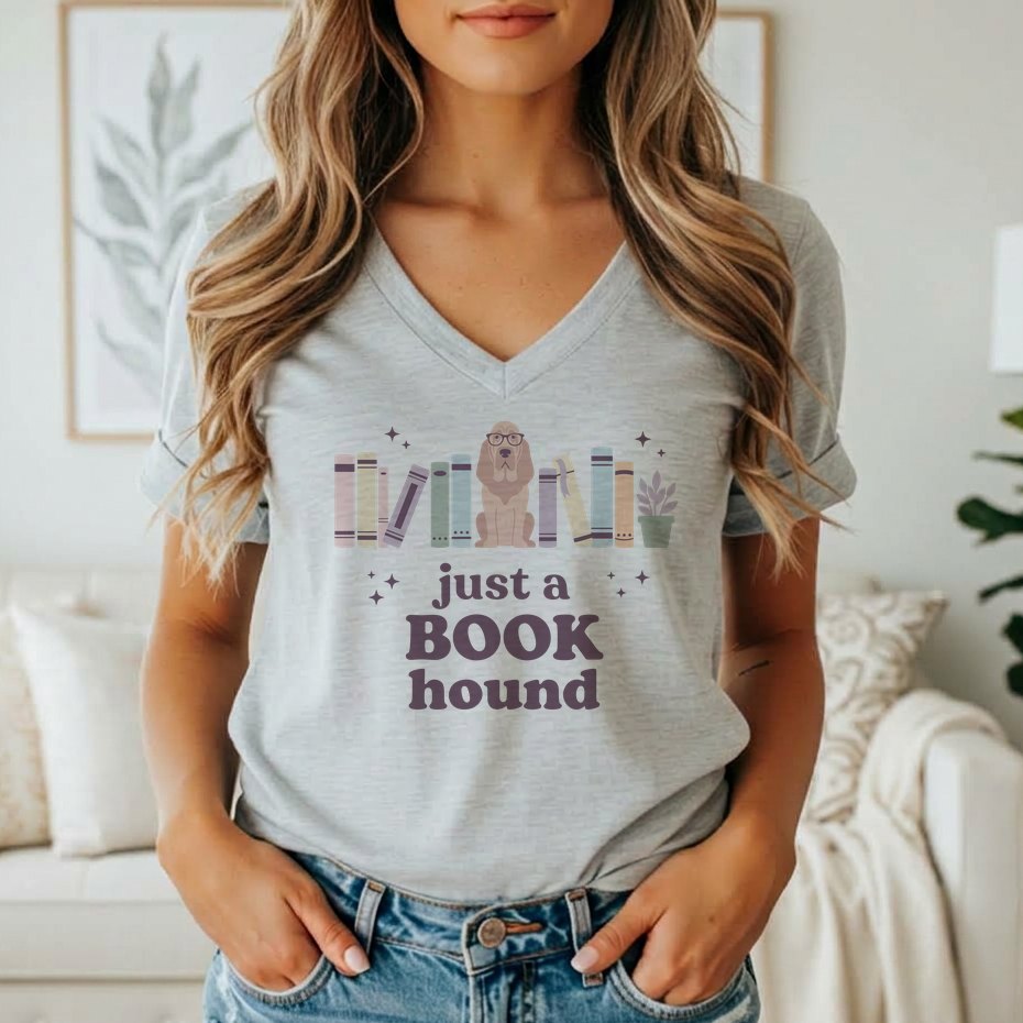 Grey t-shirt graphic with a dog and books, reading "just a book hound."