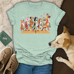 T-shirt graphic featuring a line of cartoon dogs dressed for a tennis match.