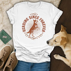 White t-shirt with "Herding Since Forever" graphic featuring a dog.