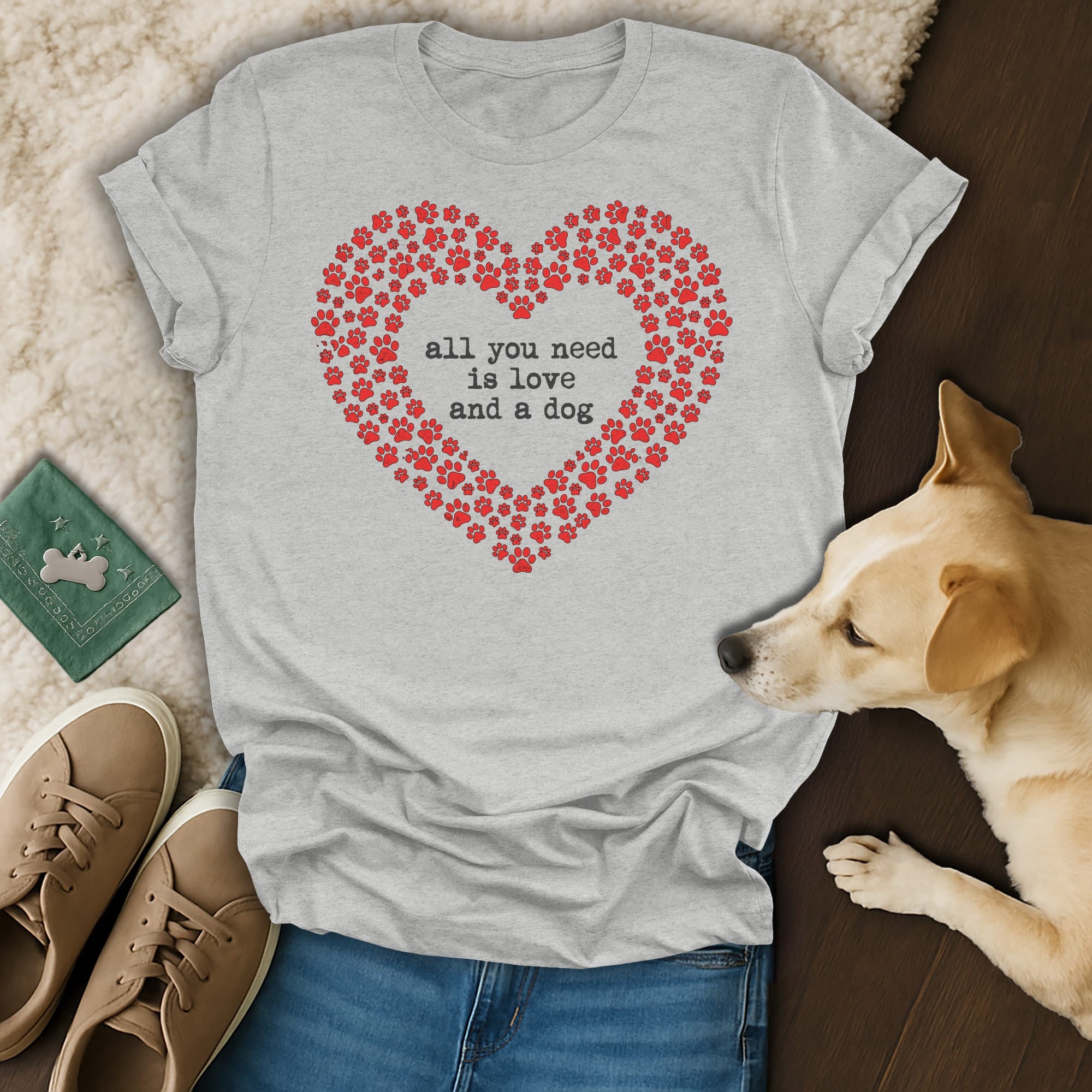 Grey t-shirt with red paw prints forming a heart and "all you need is love and a dog".