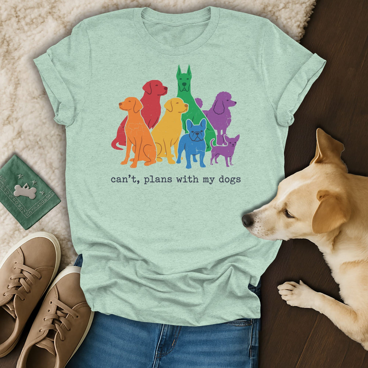 T-shirt with colorful dog silhouettes and text "can't, plans with my dogs."