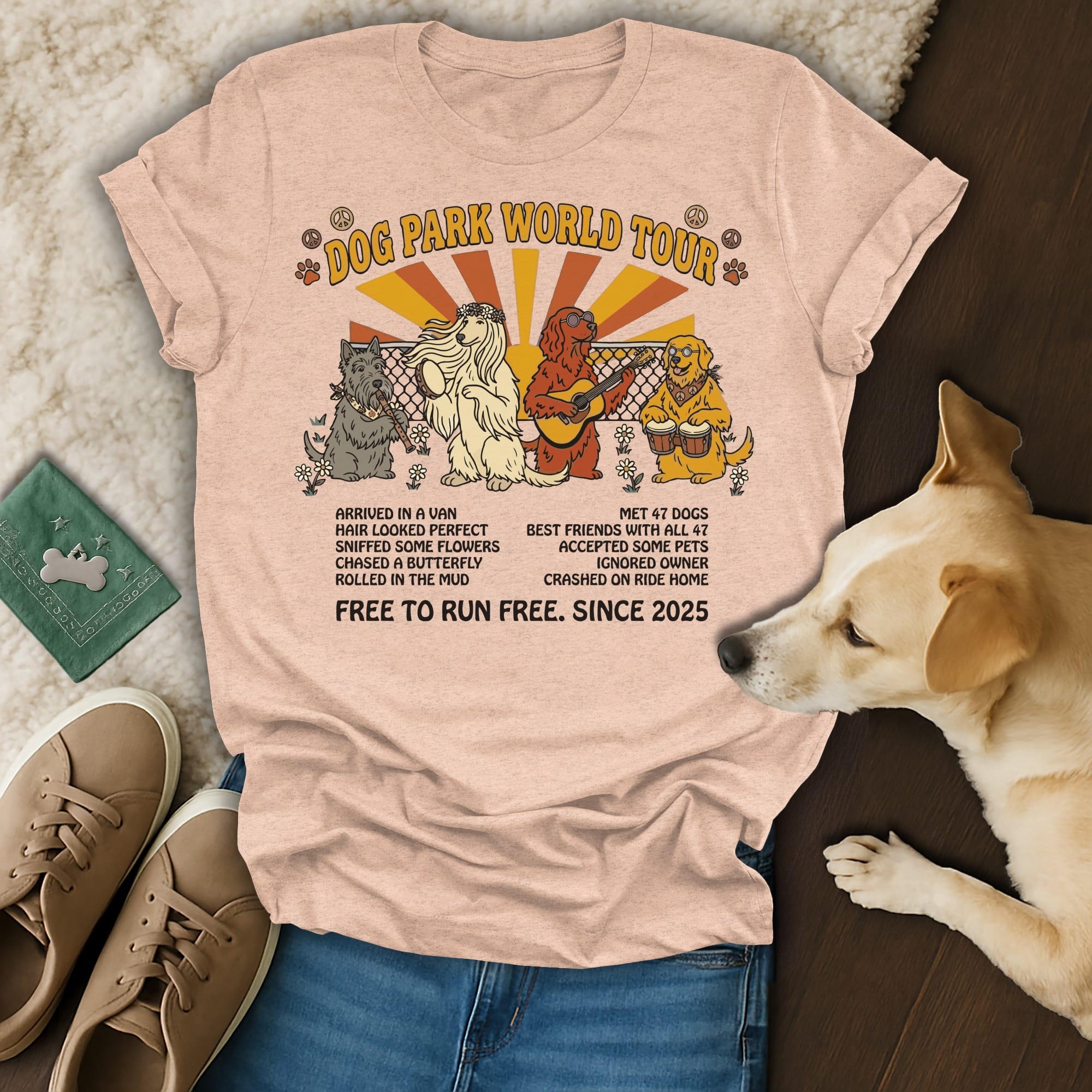 "Dog Park World Tour" t-shirt with dogs and van graphic, featuring text about dog adventures.