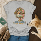 Grey crewneck t-shirt featuring a dog looking out of a floral birdhouse and the text Home Is Where The Dog Is.