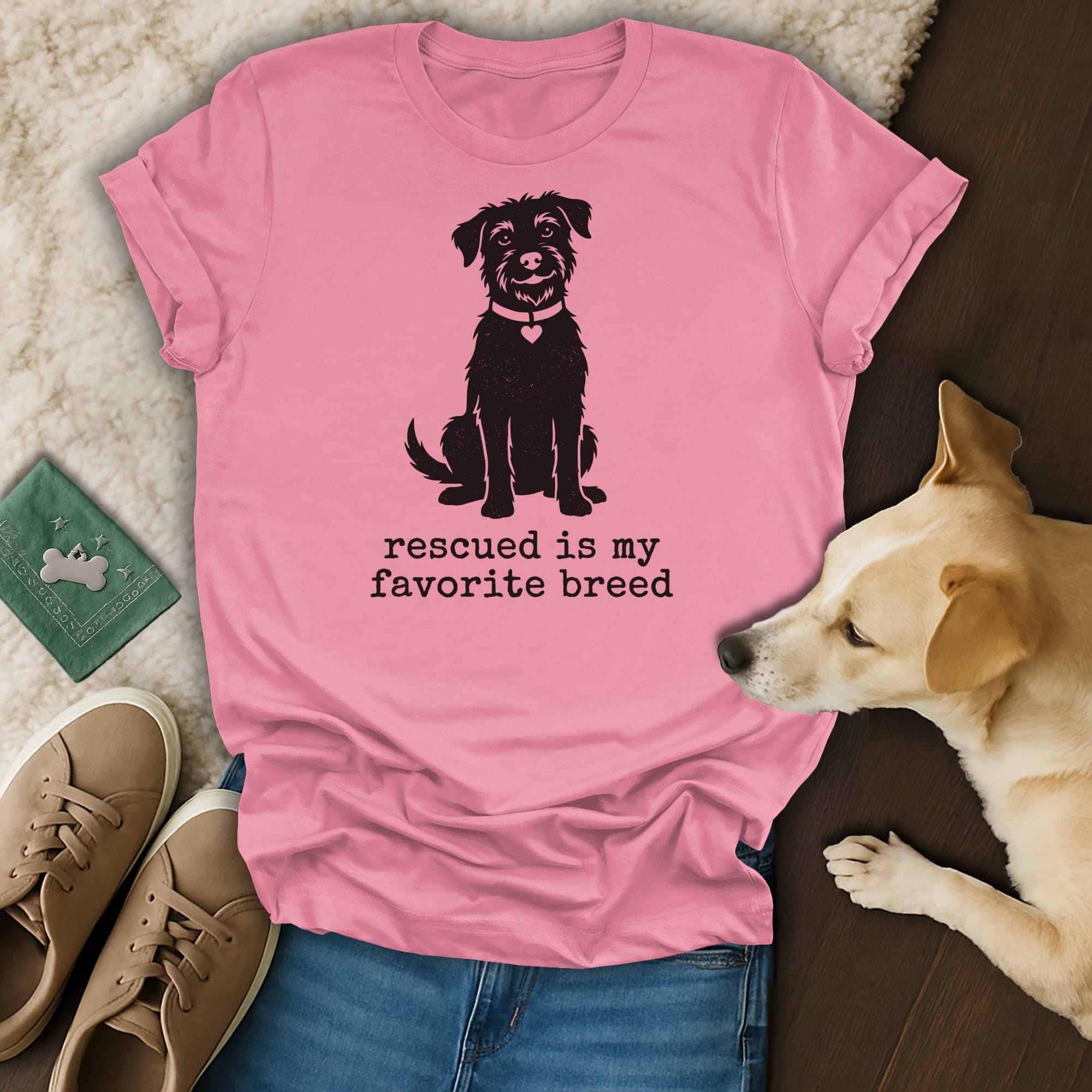 Pink t-shirt with a dog silhouette and "Rescued is my favorite breed" text.