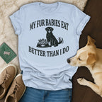 T-shirt with black text and a dog sitting next to a bowl of food.