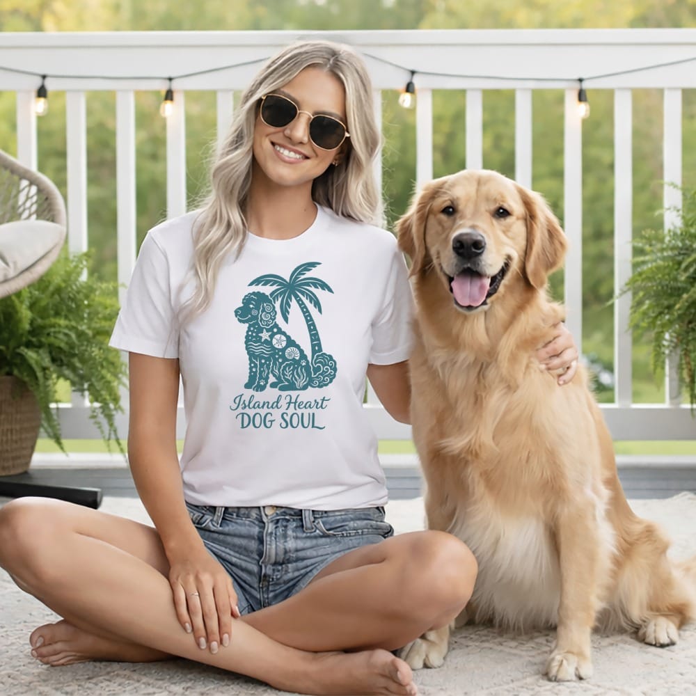 Woman in white t-shirt with dog graphic and text "Island Heart Dog Soul" with golden retriever.