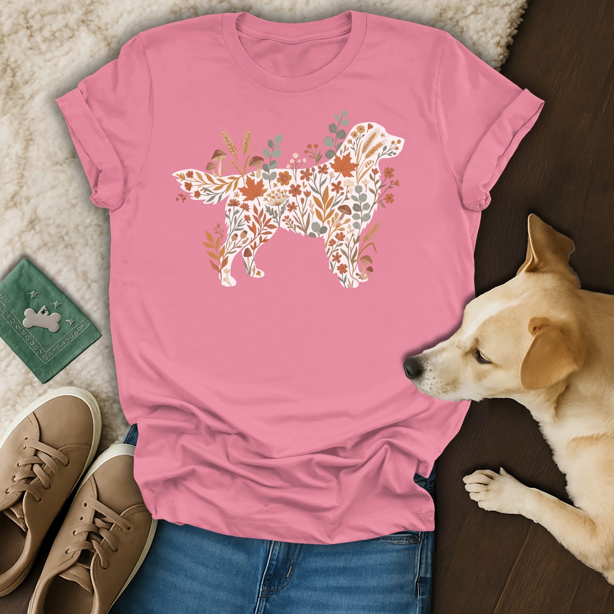 Pink t-shirt with a dog silhouette filled with autumn leaves, flowers, and mushrooms.
