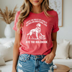 Golden retriever standing on books with text "WROTE THE RULES OF LOYALTY. DEFINED UNCONDITIONAL LOVE. ATE THE RULEBOOK."