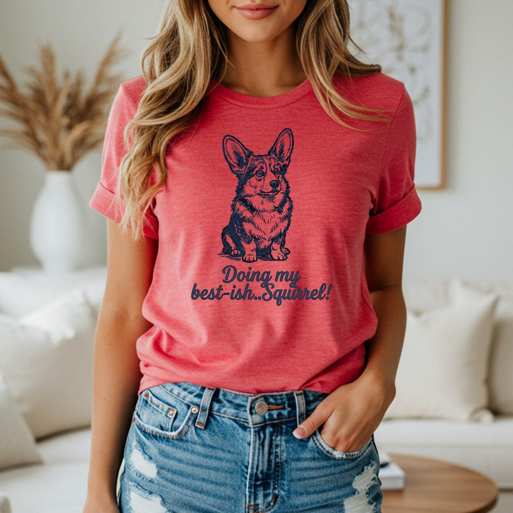 Coral t-shirt with a dark blue graphic of a Corgi and text "Doing my best-ish. Squirrel!".