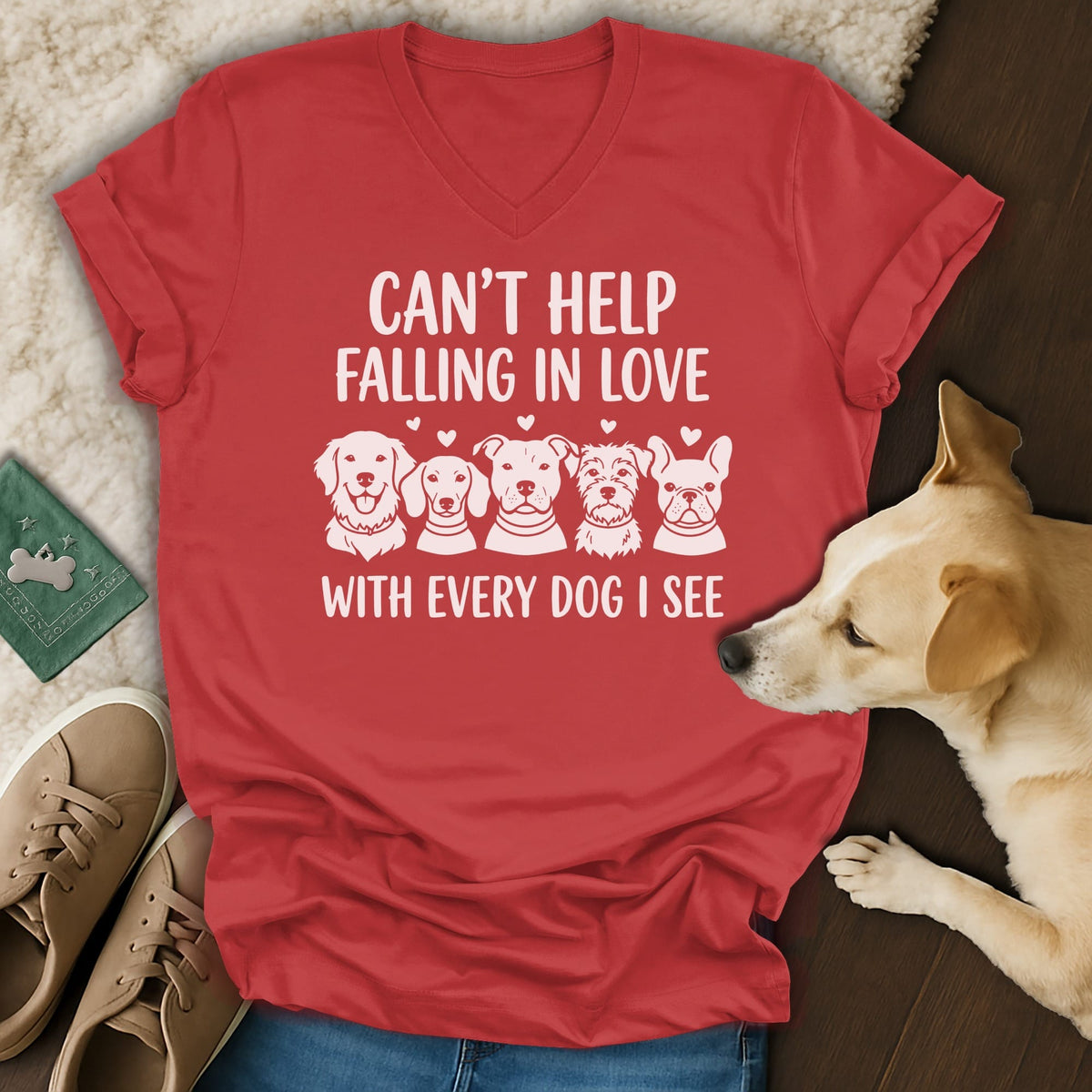 Red t-shirt with white text "CAN'T HELP FALLING IN LOVE WITH EVERY DOG I SEE" and dog illustrations.
