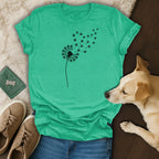 Teal t-shirt with a dandelion design made of paw prints.