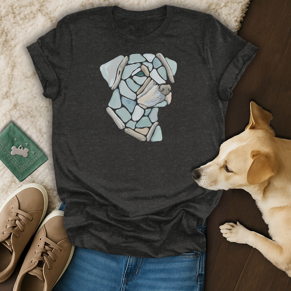 Dark grey t-shirt with a mosaic dog face graphic and a real dog.