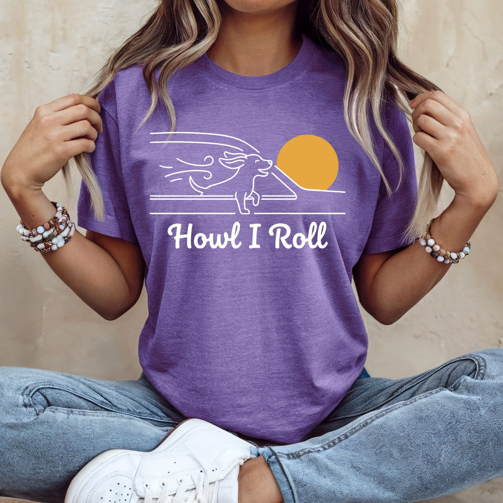 Purple t-shirt with white graphic of a dog running and text "Howl I Roll".