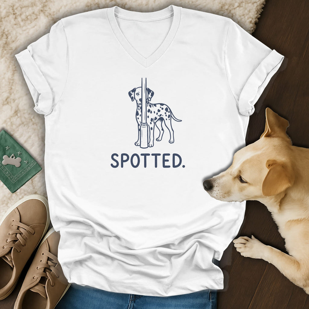 White v-neck t-shirt with a dalmatian graphic and the word SPOTTED.