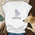 White v-neck t-shirt with a dalmatian graphic and the word SPOTTED.
