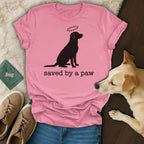 Pink t-shirt with black silhouette of a dog and paw print halo, text "saved by a paw".