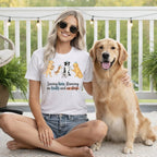 Woman with golden retriever wearing a t-shirt with cartoon dogs and text.