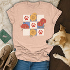 Peach t-shirt with floral and paw print grid design, dog and shoes.