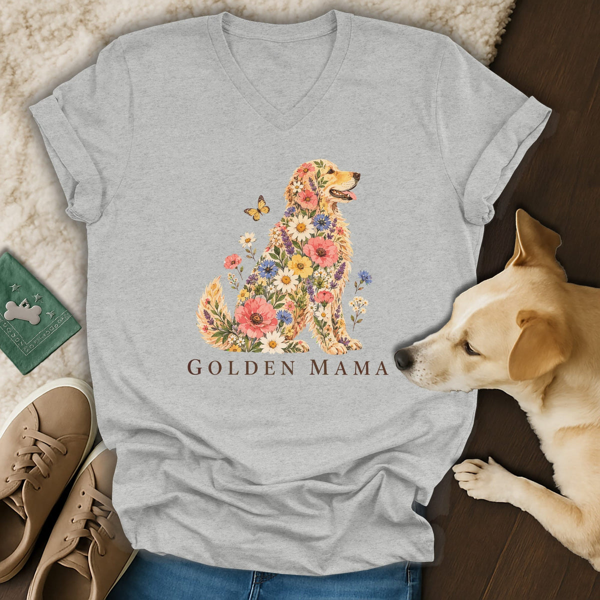 A heather gray V-neck t-shirt featuring a floral Golden Retriever graphic and the text GOLDEN MAMA.