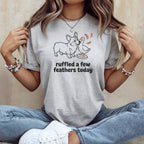 Light gray t-shirt with a line drawing of a corgi and duck with text "ruffled a few feathers today".