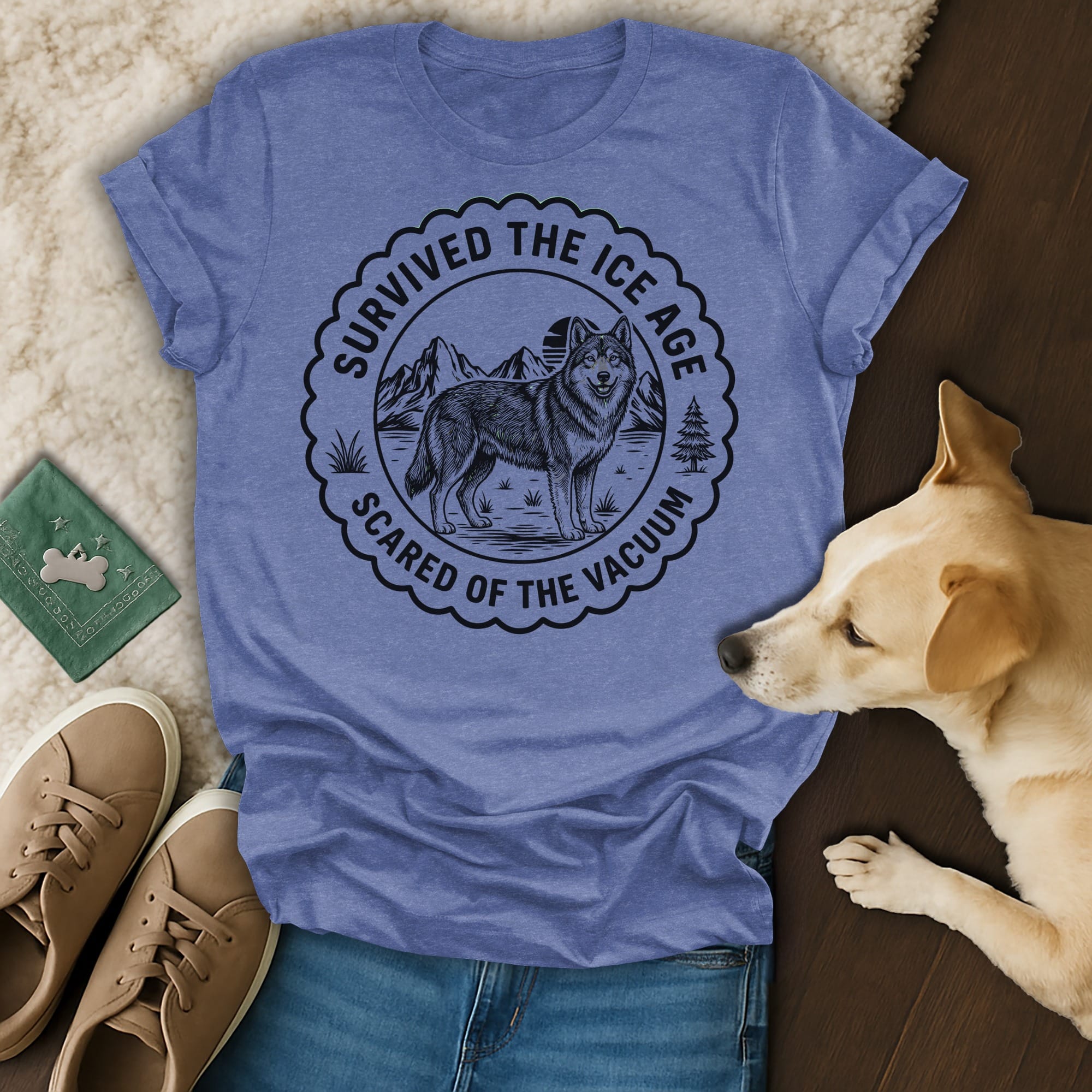 T-shirt with wolf and mountains graphic, reads "Survived the Ice Age Scared of the Vacuum."